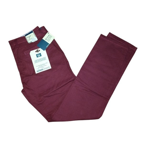 A pair of men's slim-fit chino pants in a wine color, shown with retail tags attached on a plain white background.